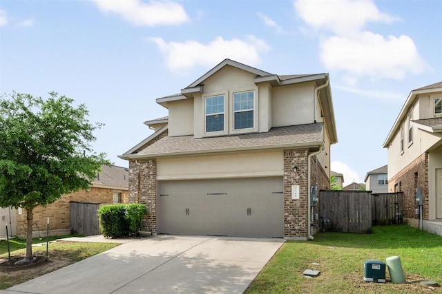 traditional-style house with an attached garage, driveway, stucco siding, and brick siding
