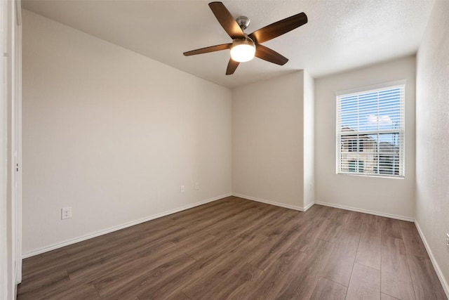 3548 Pauling Loop, Round Rock, TX 78665 - spare room featuring dark wood-style flooring and a ceiling fan