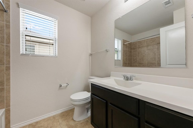 full bath featuring toilet, vanity, tile patterned flooring, and baseboards