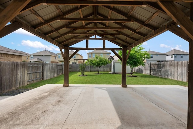 view of patio featuring a residential view, a storage shed, an outdoor structure, and a gazebo