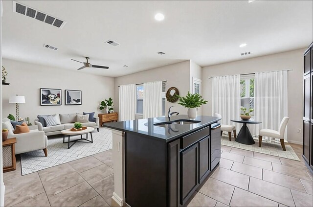 3548 Pauling Loop, Round Rock, TX 78665 - kitchen with light tile patterned floors, healthy amount of natural light, ceiling fan, an island with sink, and recessed lighting