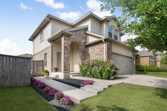 3548 Pauling Loop, Round Rock, TX 78665 - view of front of home featuring stucco siding, an attached garage, concrete driveway, and stone siding