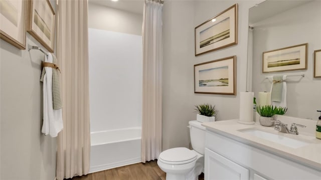 154 Sandringham Loop, Uhland, TX 78640 - bathroom with toilet, vanity, wood finished floors, and shower / tub combo with curtain