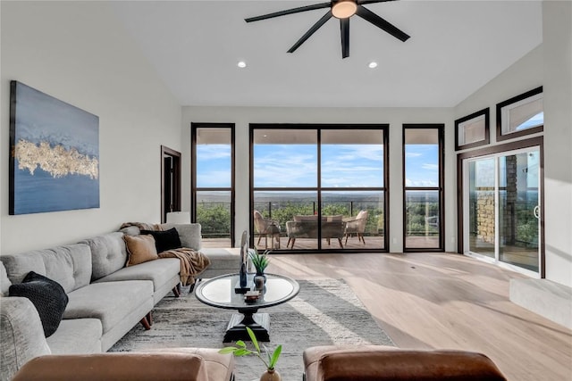 112 Paragon Ct, Lakeway, TX 78734 - living area featuring wood finished floors, ceiling fan, recessed lighting, and high vaulted ceiling