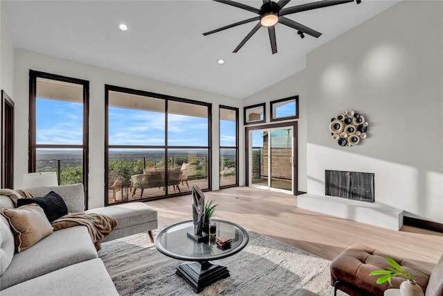 112 Paragon Ct, Lakeway, TX 78734 - living room with light wood-style flooring, a ceiling fan, recessed lighting, and high vaulted ceiling