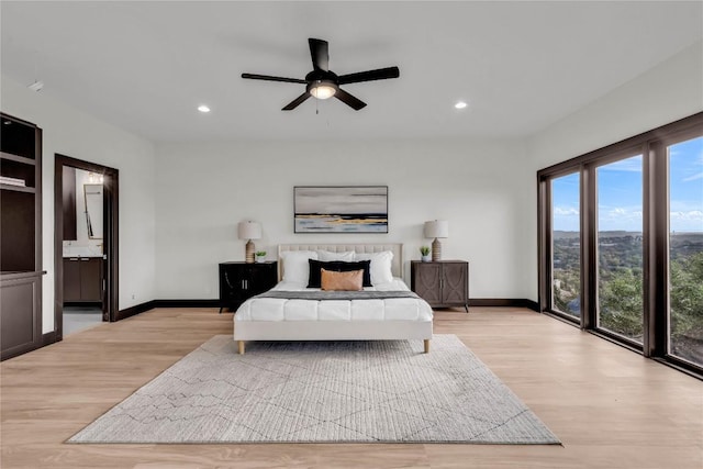 112 Paragon Ct, Lakeway, TX 78734 - bedroom with baseboards, light wood-style flooring, recessed lighting, and ensuite bath