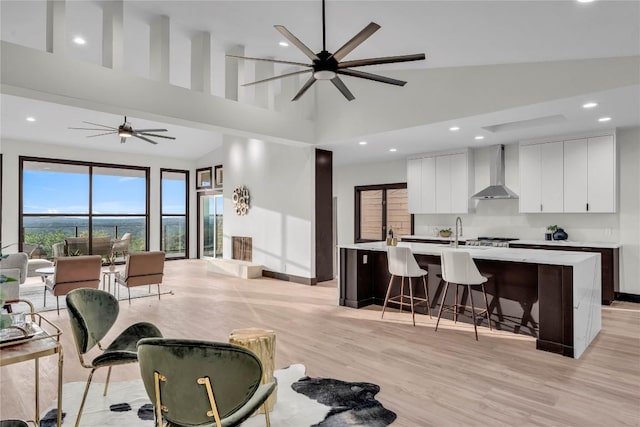 112 Paragon Ct, Lakeway, TX 78734 - living room with a ceiling fan, high vaulted ceiling, recessed lighting, and light wood-style flooring