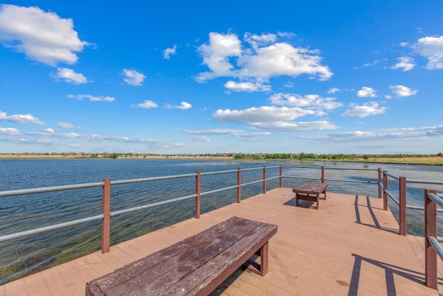 dock featuring a deck with water view