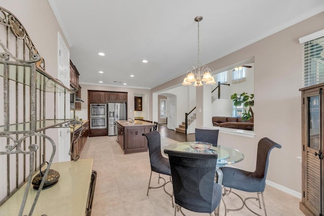 dining area with stairs, arched walkways, ornamental molding, light tile patterned floors, and recessed lighting