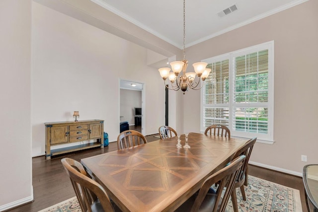 dining space with a chandelier, ornamental molding, dark wood-style flooring, and baseboards