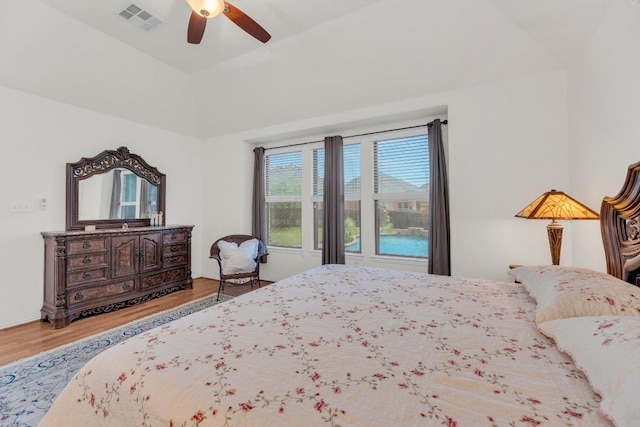 bedroom featuring wood finished floors, ceiling fan, and lofted ceiling