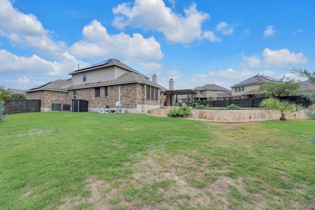 3320 Magellan Ct, Round Rock, TX 78665 - back of property featuring a pergola, a fenced backyard, and solar panels