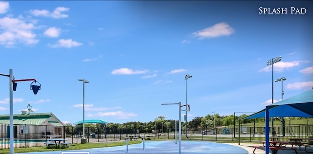view of tennis court with fence