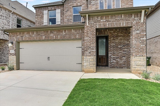 1401 S Brook Dr, Leander, TX 78641 - view of front of home with concrete driveway and brick siding