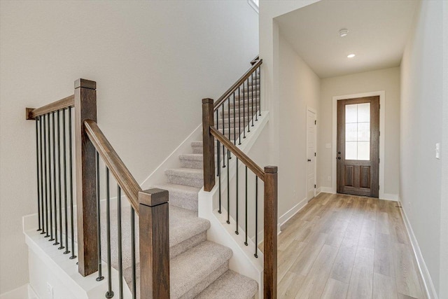 1401 S Brook Dr, Leander, TX 78641 - foyer with light wood-style floors, stairway, and recessed lighting
