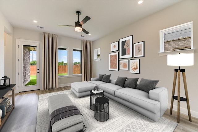 1401 S Brook Dr, Leander, TX 78641 - living area with a ceiling fan, wood finished floors, and recessed lighting