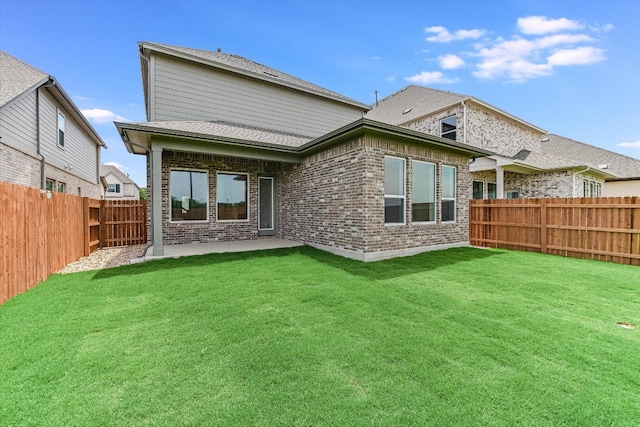 1401 S Brook Dr, Leander, TX 78641 - back of property with brick siding, a fenced backyard, and a patio area