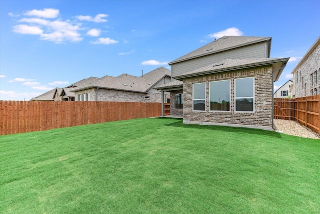 1401 S Brook Dr, Leander, TX 78641 - back of property featuring a fenced backyard and brick siding