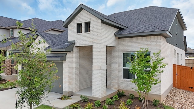 204 Ridgewell Loop, Georgetown, TX 78633 - view of front of home featuring a shingled roof and brick siding