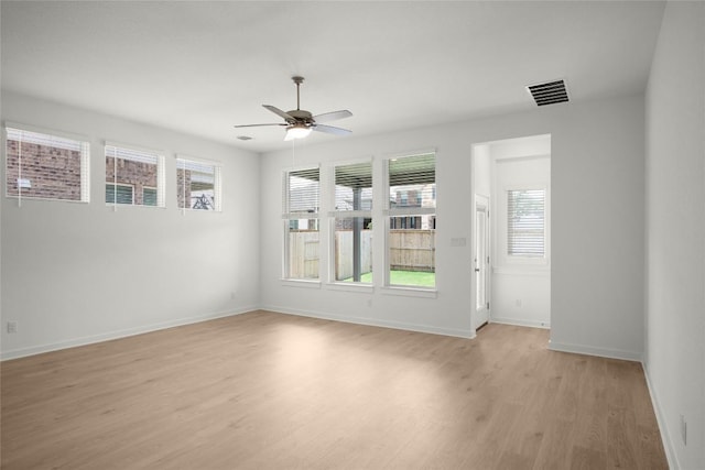 204 Ridgewell Loop, Georgetown, TX 78633 - unfurnished room with light wood-type flooring, healthy amount of natural light, ceiling fan, and baseboards