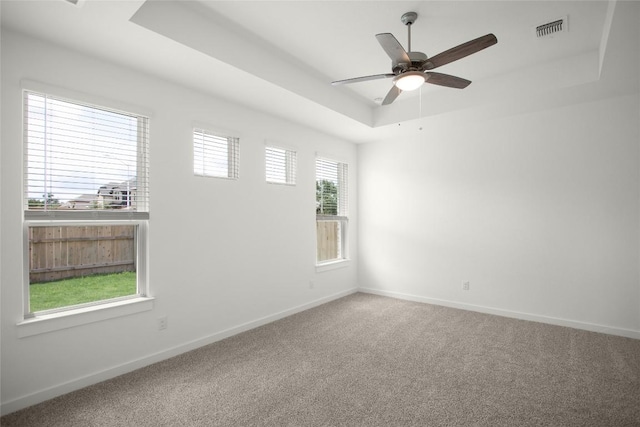 204 Ridgewell Loop, Georgetown, TX 78633 - spare room with a tray ceiling, carpet flooring, baseboards, and ceiling fan