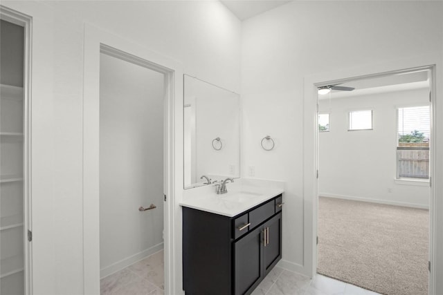204 Ridgewell Loop, Georgetown, TX 78633 - bathroom featuring vanity, ceiling fan, a spacious closet, and baseboards