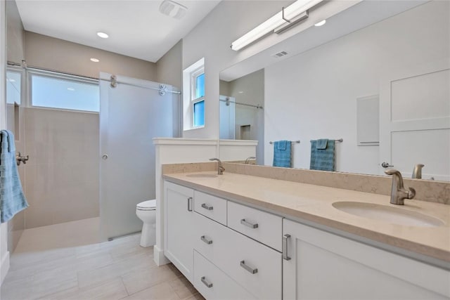 bathroom featuring plenty of natural light, walk in shower, toilet, and recessed lighting