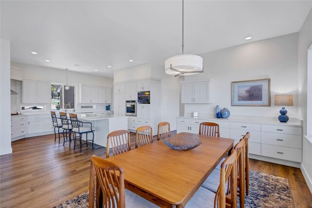 dining room featuring light wood finished floors and recessed lighting