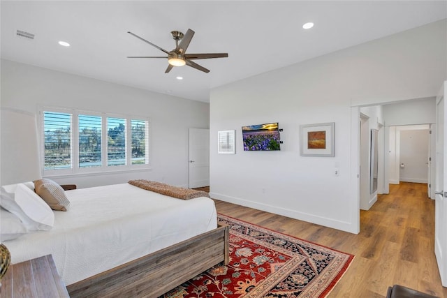 bedroom with light wood-style flooring, recessed lighting, baseboards, and a ceiling fan