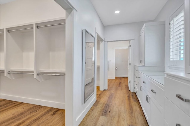 walk in closet featuring light wood-style floors