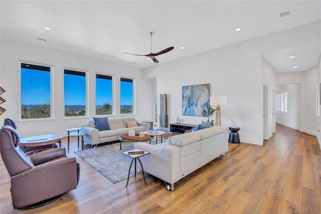 living room with ceiling fan, light wood-style floors, baseboards, and recessed lighting