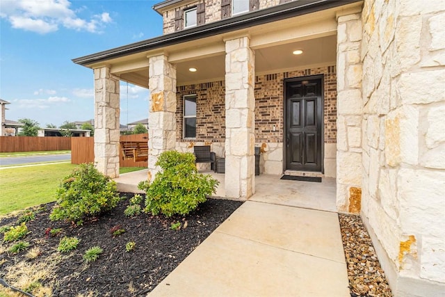 2017 Prickly Pear Dr, Bastrop, TX 78602 - entrance to property with stone siding and a porch