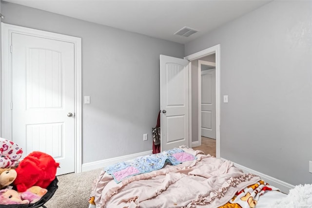 bedroom featuring carpet flooring and baseboards