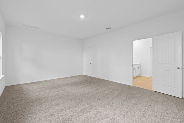 2416 Cattle Baron Trl, Leander, TX 78641 - spare room with carpet flooring, baseboards, and recessed lighting