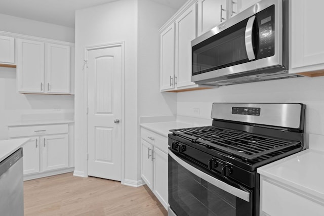 2416 Cattle Baron Trl, Leander, TX 78641 - kitchen with appliances with stainless steel finishes, light wood-type flooring, and white cabinets