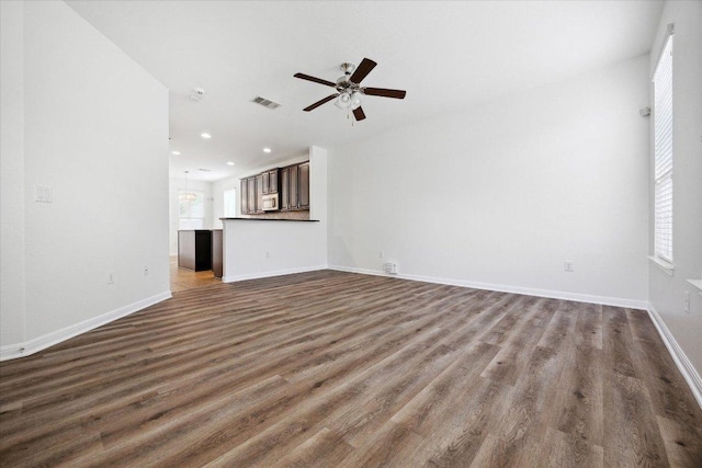 unfurnished living room featuring a ceiling fan, dark wood-style floors, recessed lighting, and baseboards