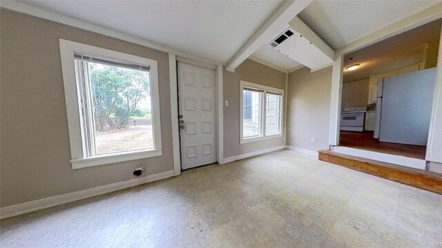 entryway featuring healthy amount of natural light, baseboards, and tile patterned floors