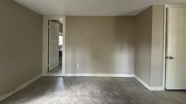 empty room with baseboards