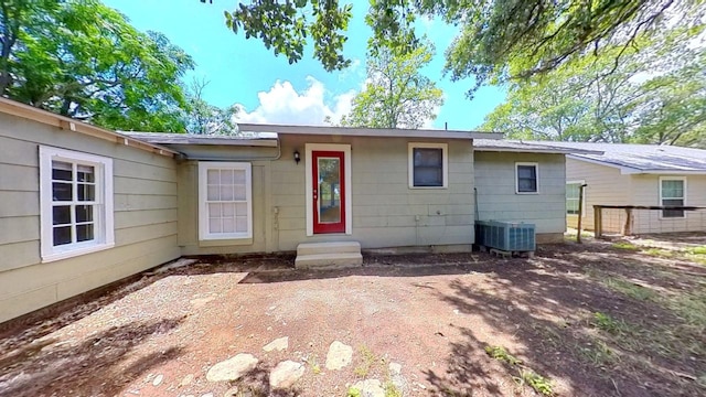 view of front of house with entry steps and central air condition unit