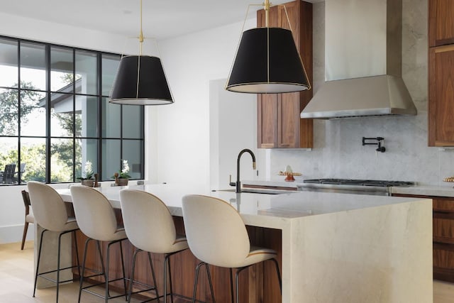 4405 Hennig Dr, Austin, TX 78738 - kitchen with wall chimney exhaust hood, a sink, backsplash, and brown cabinets