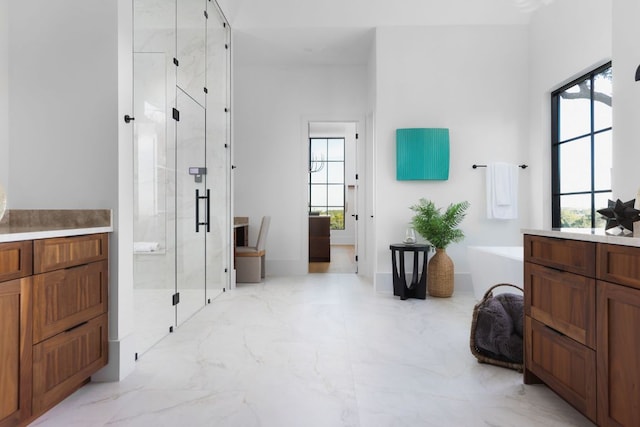 4405 Hennig Dr, Austin, TX 78738 - full bath with a marble finish shower, a freestanding tub, and marble finish floors