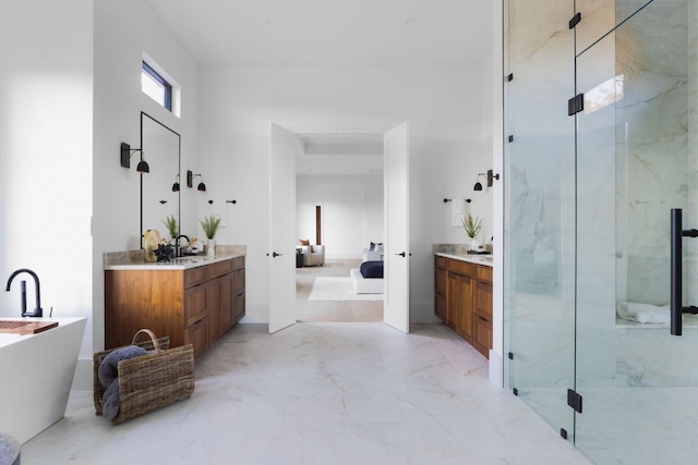 4405 Hennig Dr, Austin, TX 78738 - bathroom with a marble finish shower, two vanities, ensuite bathroom, marble finish flooring, and a freestanding bath