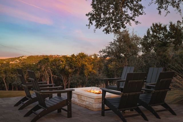 4405 Hennig Dr, Austin, TX 78738 - patio terrace at dusk with a fire pit and a patio