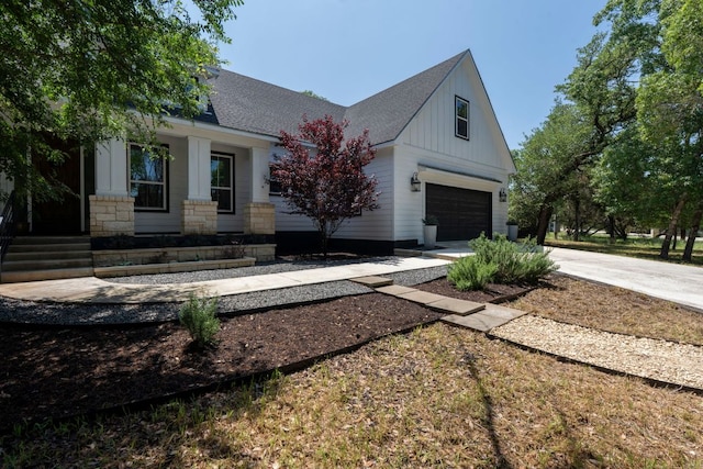 4 La Toya Trl, Wimberley, TX 78676 - modern farmhouse style home with a garage, board and batten siding, concrete driveway, and a shingled roof