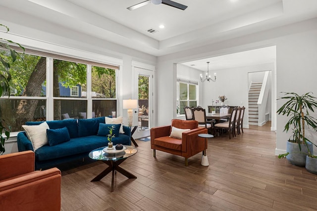 4 La Toya Trl, Wimberley, TX 78676 - living room with a tray ceiling, ceiling fan, wood finished floors, a chandelier, and recessed lighting