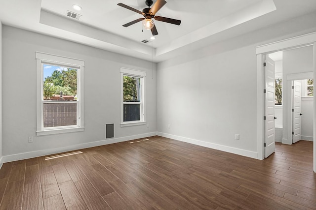 4 La Toya Trl, Wimberley, TX 78676 - empty room with a raised ceiling, ceiling fan, dark wood-style flooring, and recessed lighting