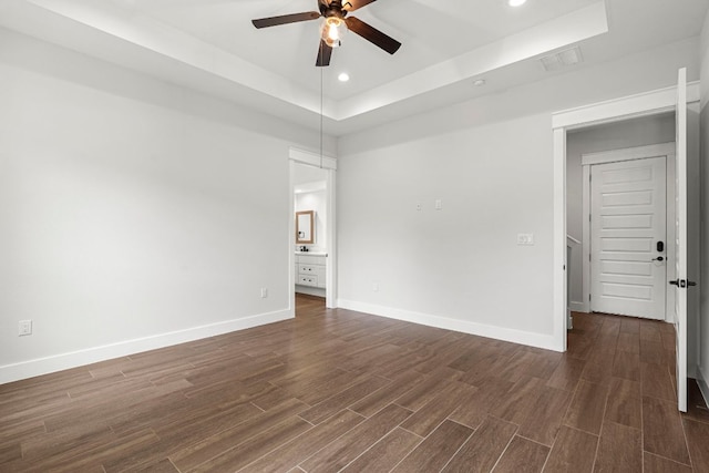 4 La Toya Trl, Wimberley, TX 78676 - empty room featuring a raised ceiling, a ceiling fan, dark wood finished floors, and recessed lighting
