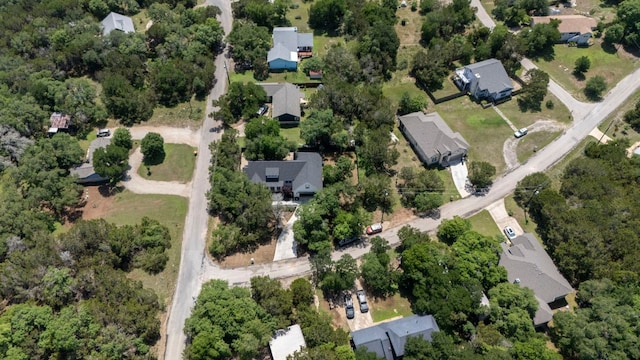 aerial view of property and surrounding area with nearby suburban area