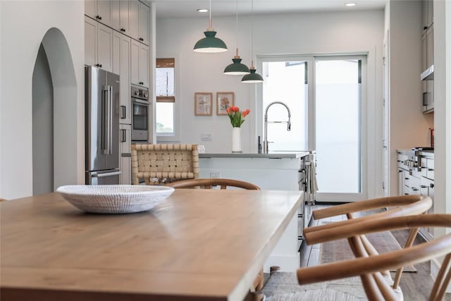 4609 Unity Cir, Austin, TX 78731 - dining area with arched walkways and recessed lighting