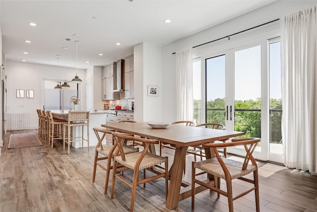 4609 Unity Cir, Austin, TX 78731 - dining room featuring light wood-style flooring and recessed lighting